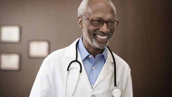 doctor smiling wearing stethoscope