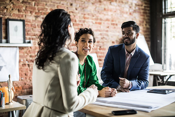 Three people having a business meeting