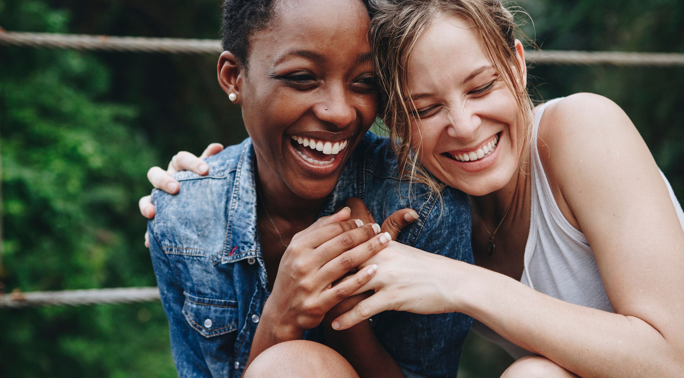 Two women in fits of laughter