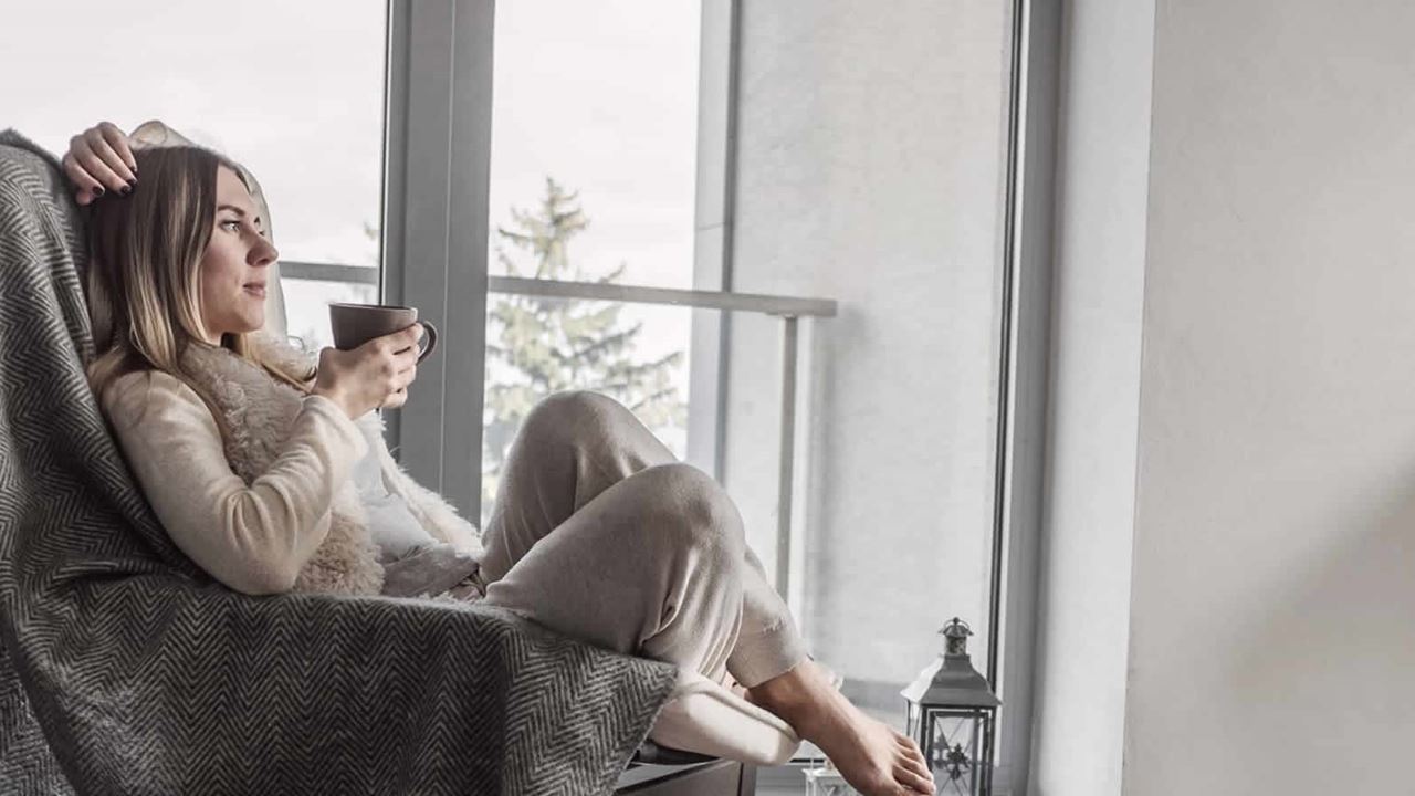 Pensive woman on chair