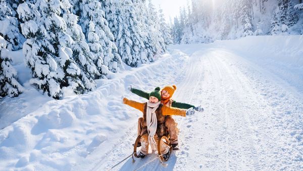 Happy children on a sled in Finland