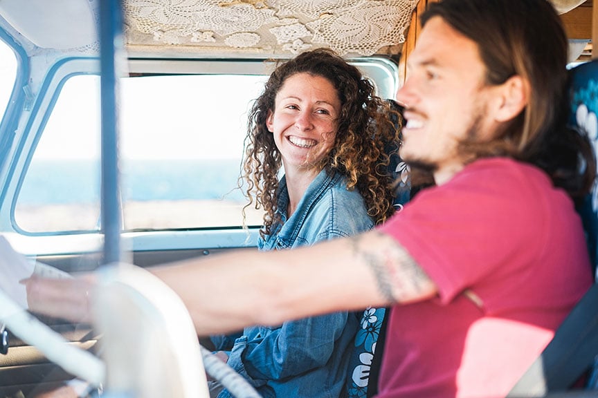 couple-driving-and-laughing