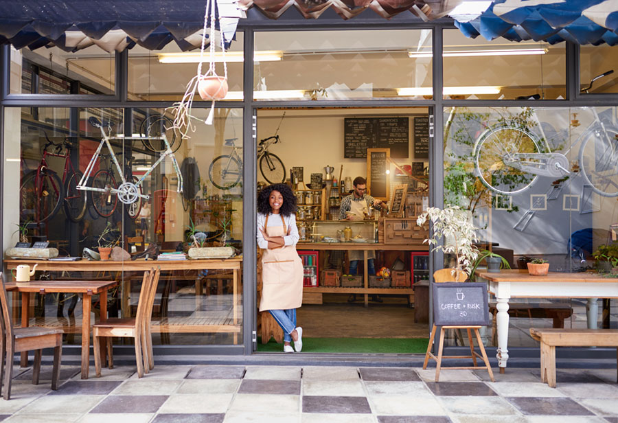 Barista in a cafe doorway