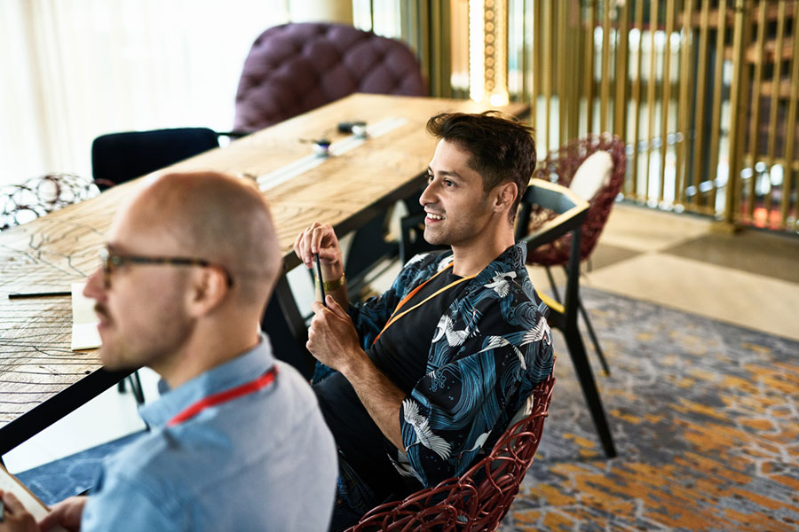 youn professional man sitting in meeting