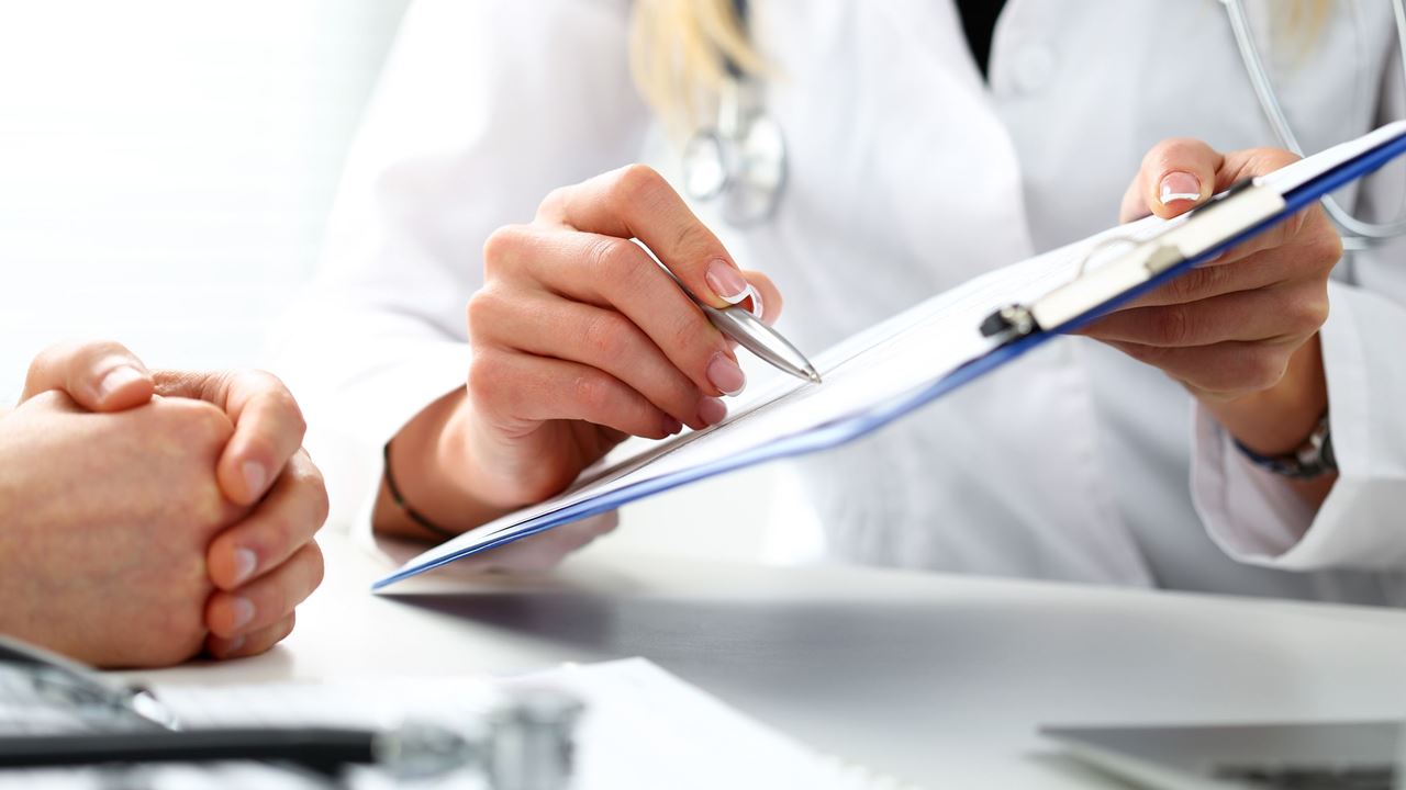 doctor showing notes