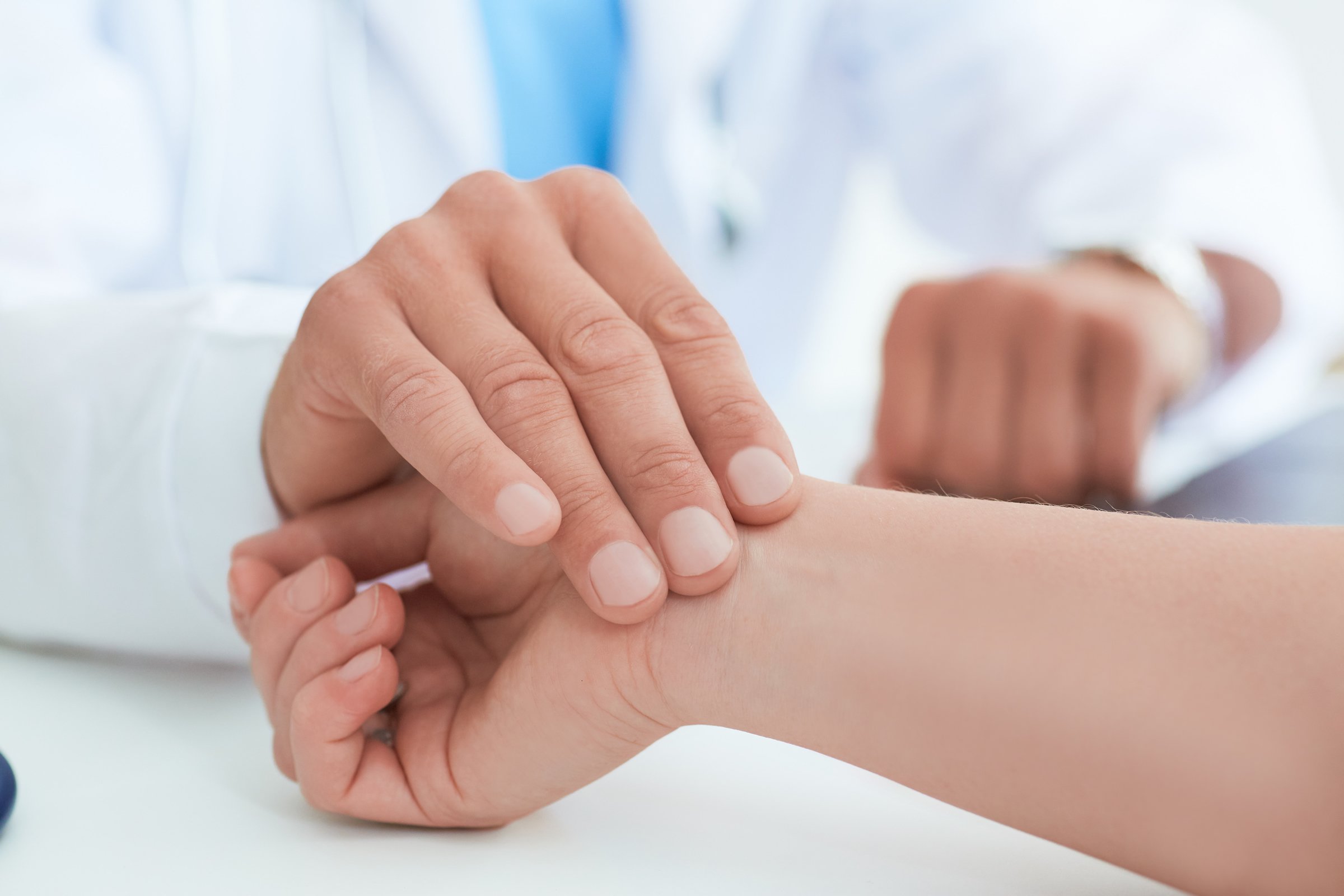 Doctor checking patient's blood pressure