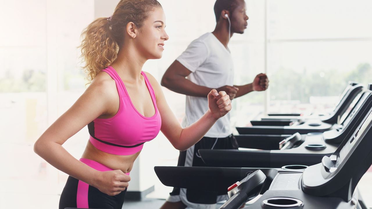 Woman and man in a gym