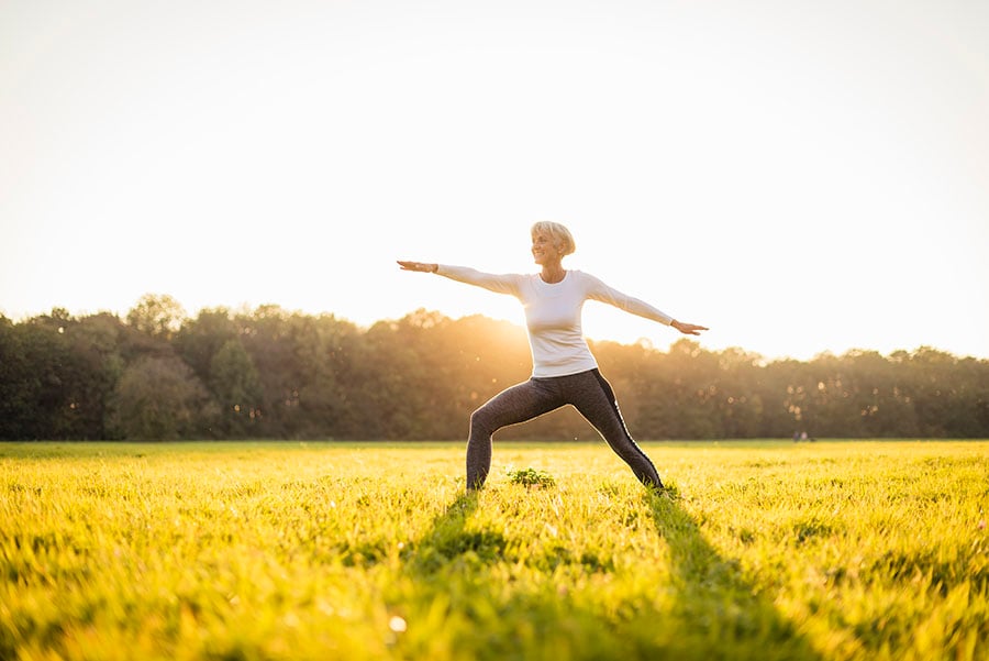 Lady exercising in a field