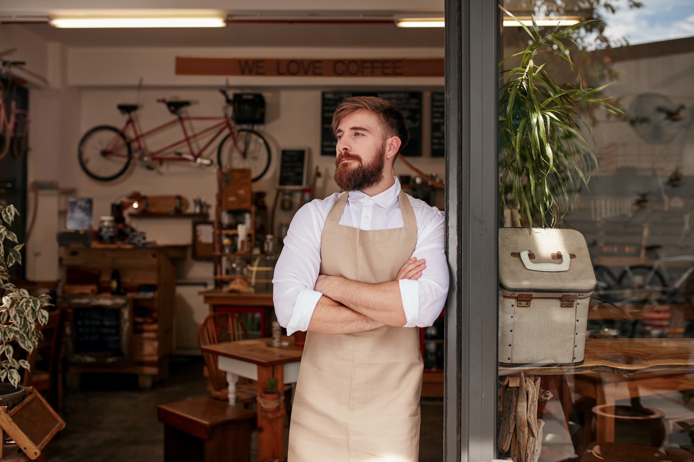man in shopfront