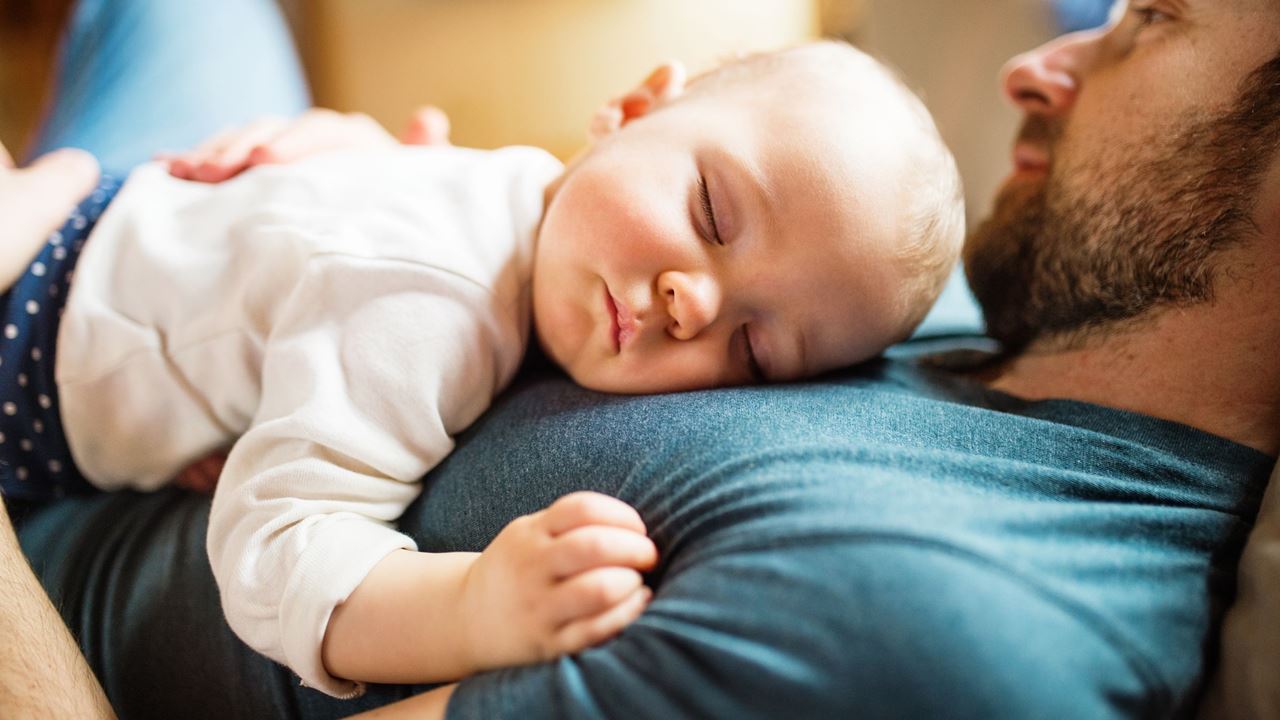 Dad with sleeping baby