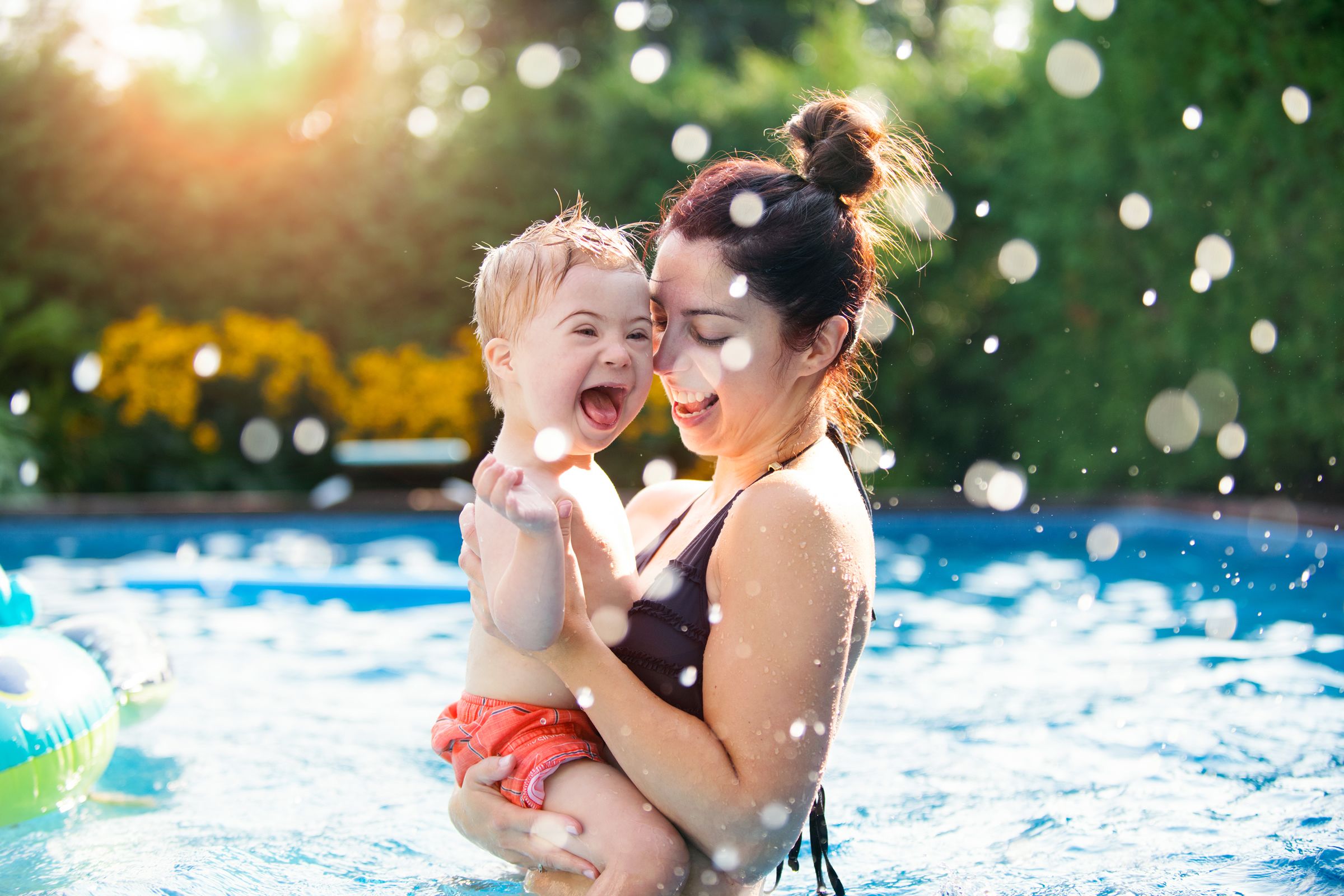 Mum and child swimming