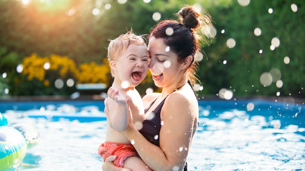 Mum and child swimming